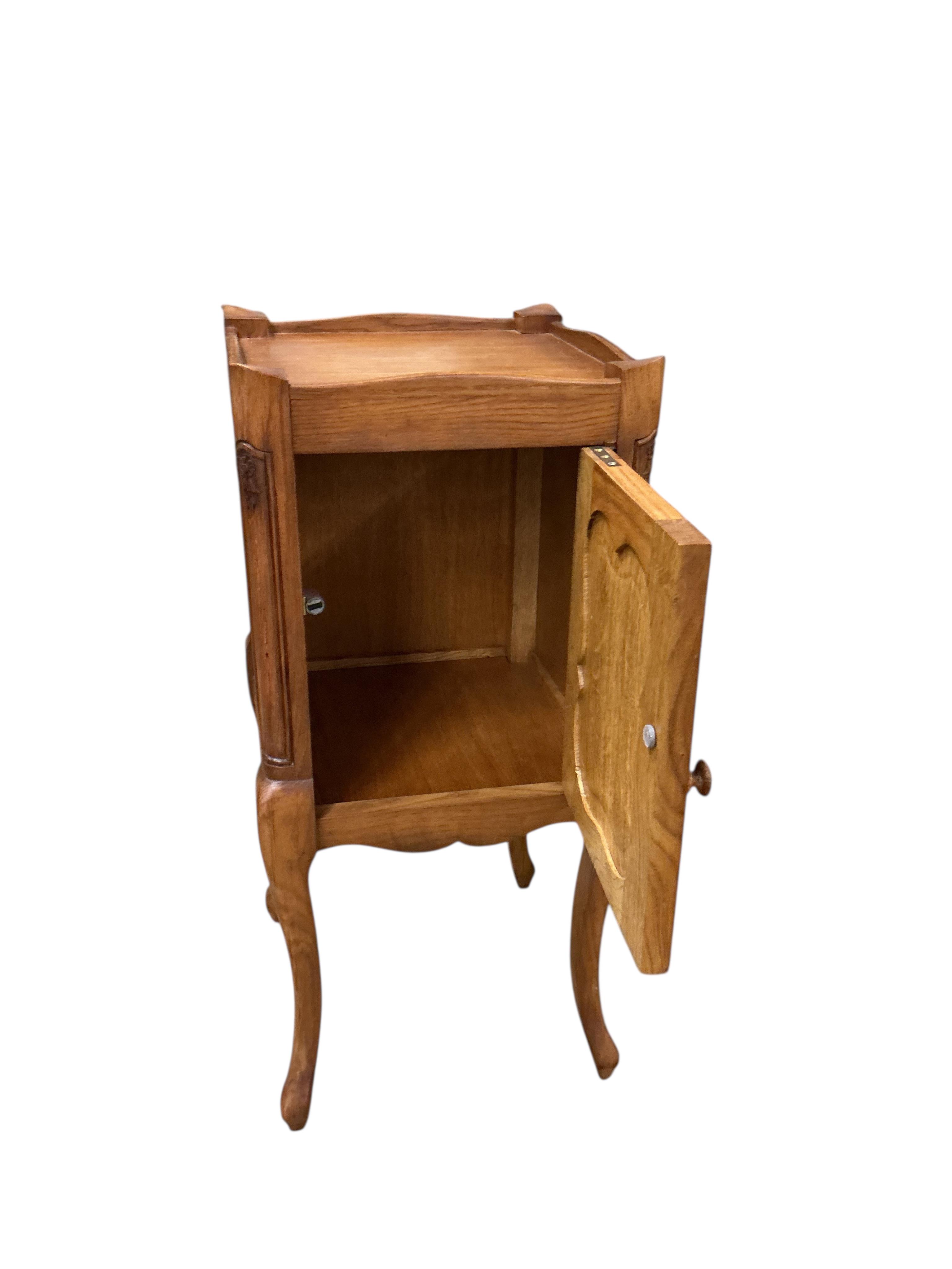 A pair of French oak bedside cabinets, width 34cm, depth 34cm, height 75cm